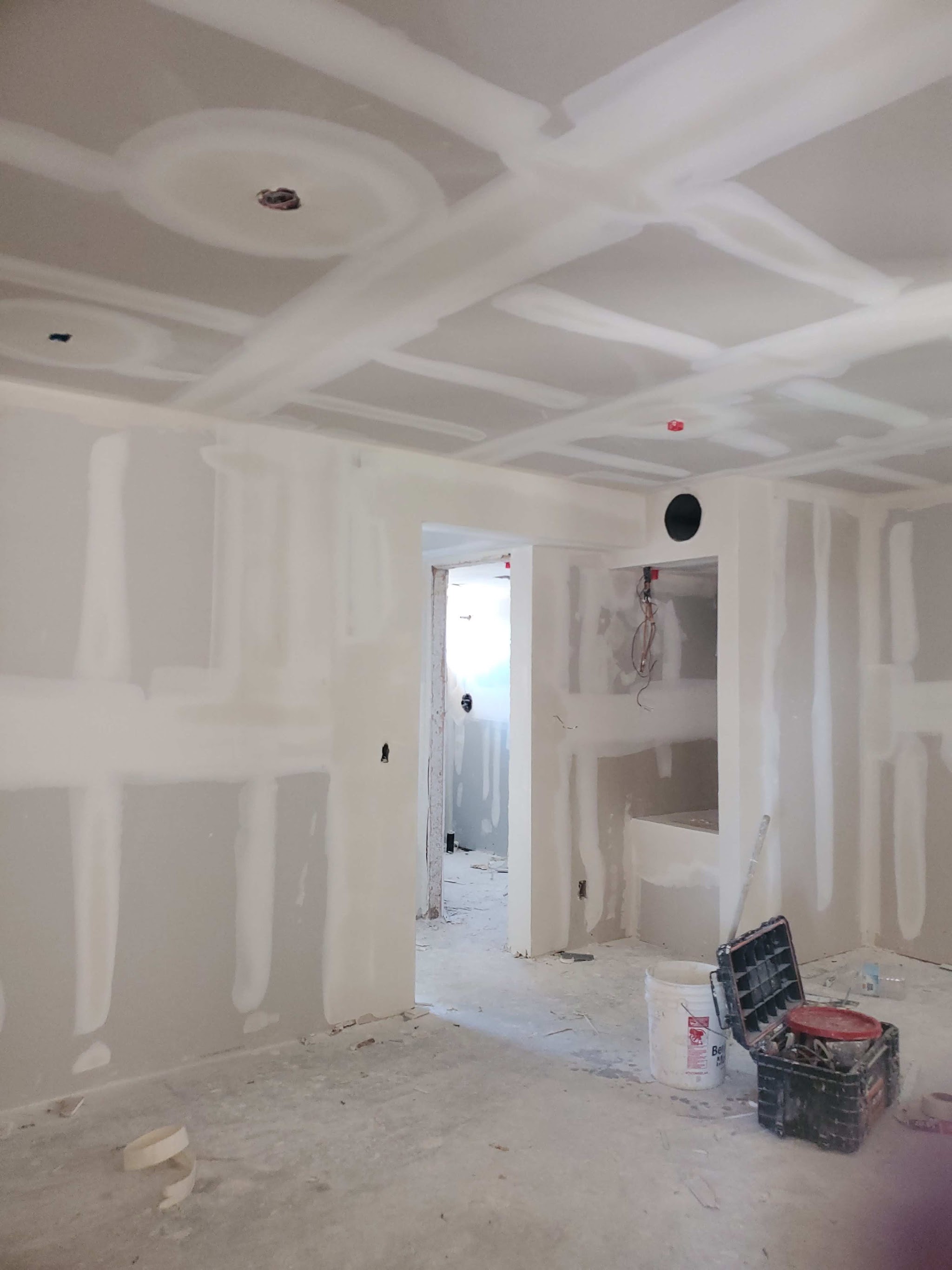 New construction room with ceiling supply registers ready for finish