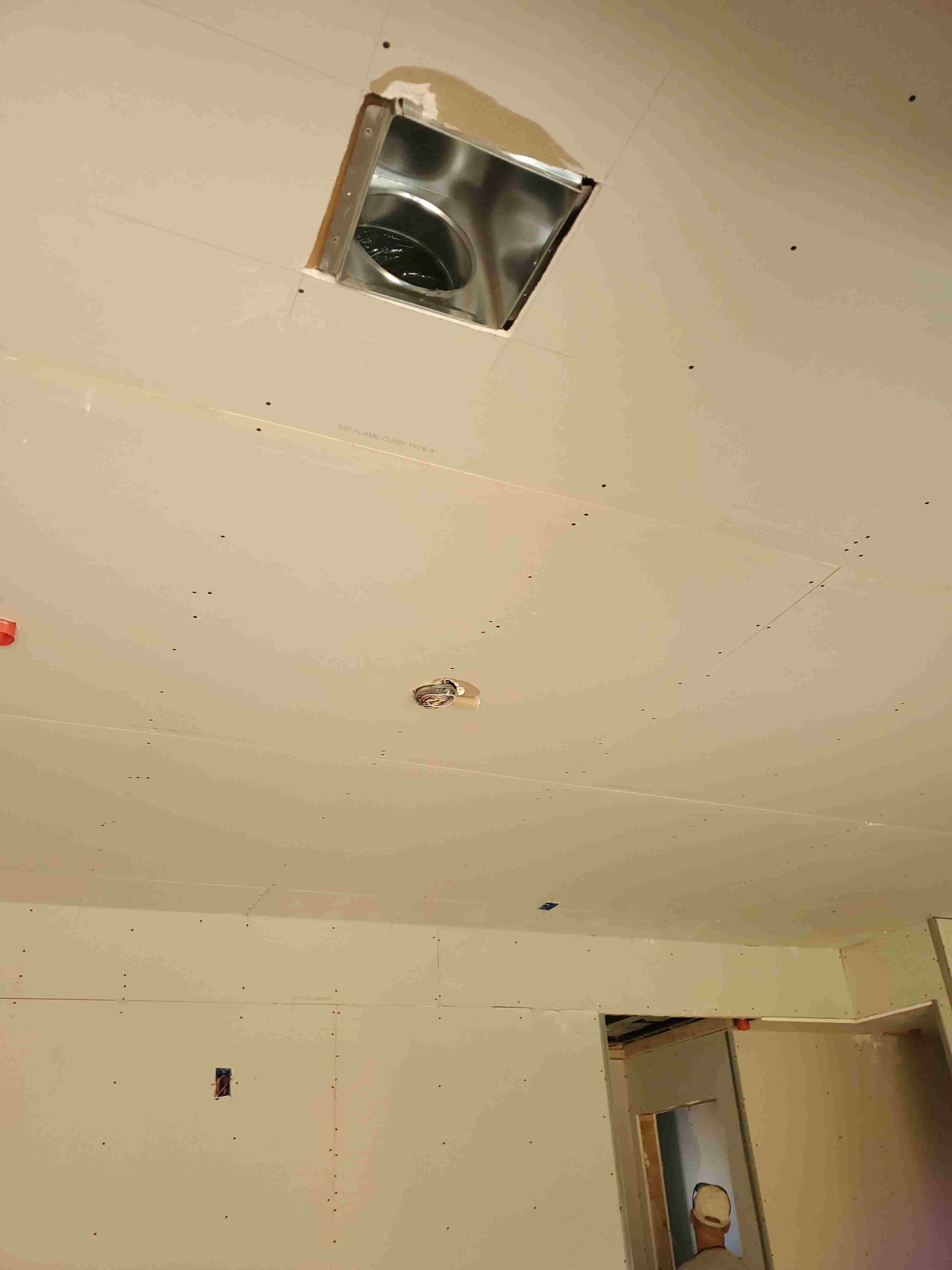 New ceiling with a supply register boot cut in